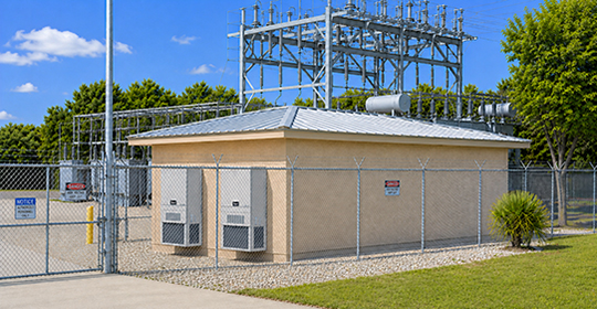 Image of a Power Utility Substation Control Building with two air conditioner units